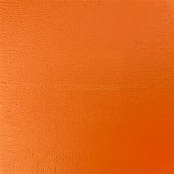 Orange textured wall with granular stucco finish, consistent saturated color, and diffused lighting highlighting surface imperfections.